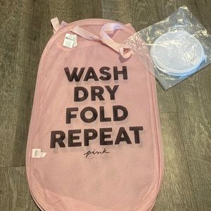 Foldable, pink mesh hamper with handles